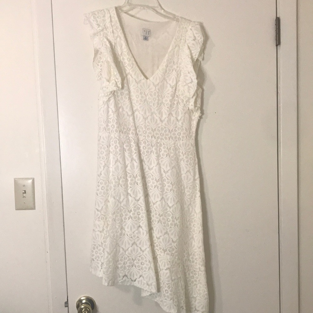 Slanted eyelit dress, flutter sleeves. A new day